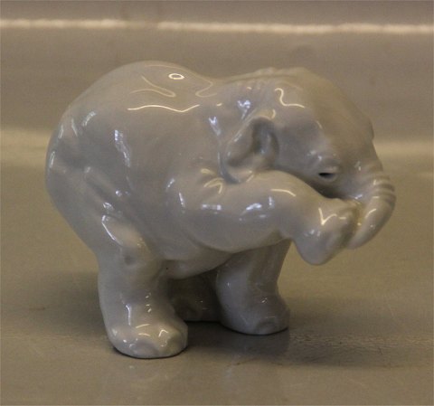 Royal Copenhagen Art Pottery
22741  RC White Elephant young with leg up 7.5 cm  March 1982 Jeanne Grut