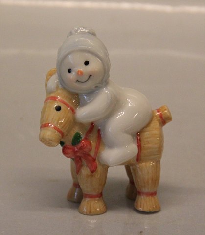 Royal Copenhagen figurine 0761 RC Winther series, Snowman, Baby Arthur Baby on 
straw goat 8 cm (1249761) Henny Iversen 2010
