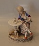 Royal Copenhagen 12127 Over glaze Lady with table 
