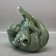 Royal Copenhagen Art Pottery
1-3106 RC Seal fighting a large fish Knud Kyhn Celedon glaze 22 x 22 cm