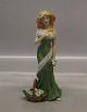 Royal Copenhagen figurine 
0551 RC "Spring Time" Girl in green with flower basket ca 21 cm